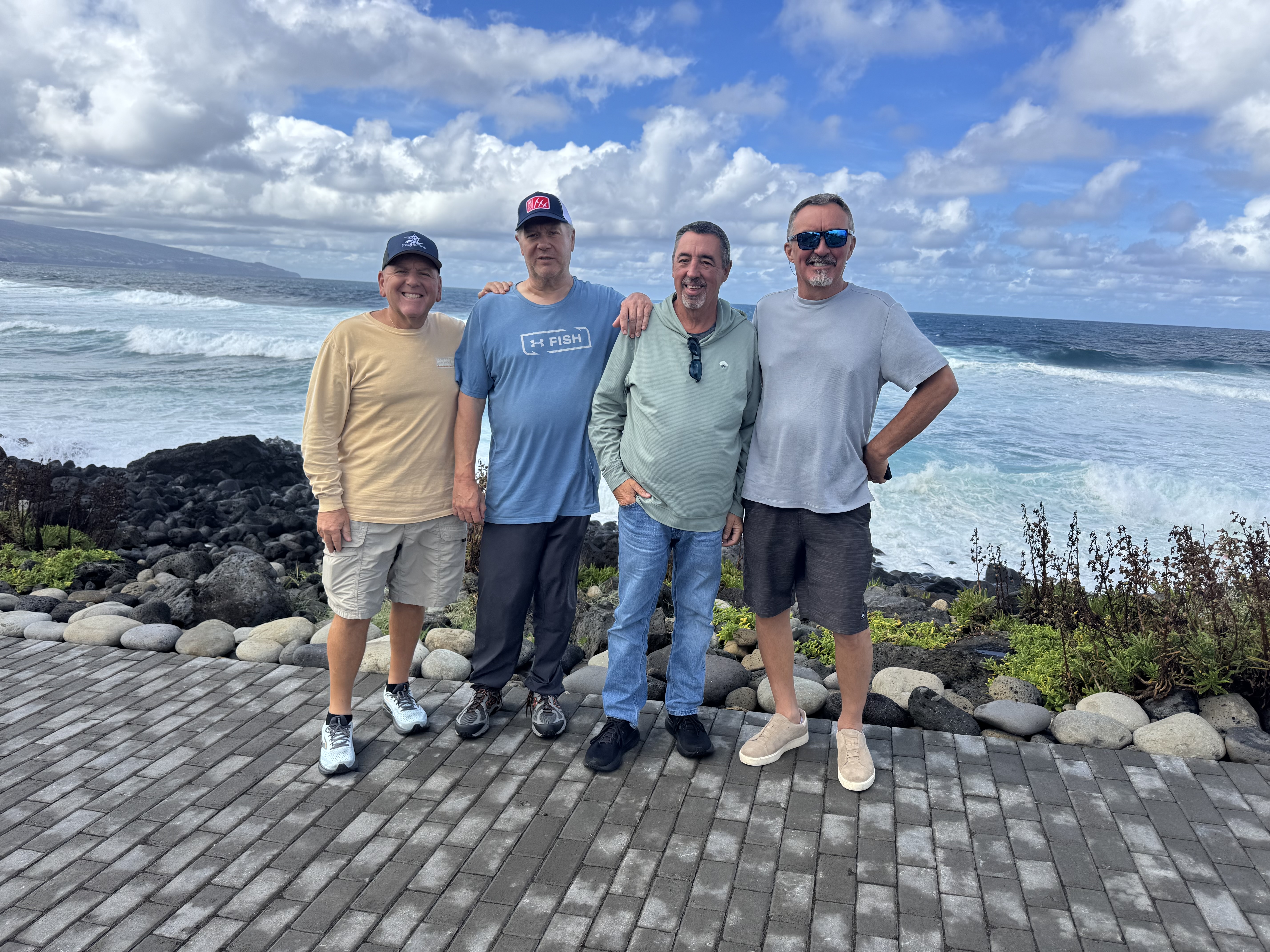 Four anglers on the rocky Atlantic coast of the Azores.