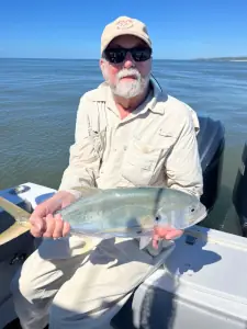 Angler holding a crevalle jack on the boat in Costa Rica