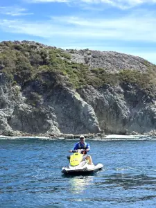 Angler with a fish caught from a jetski in Costa Rica