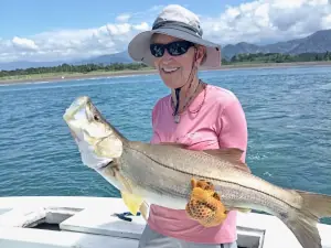 Angler holding a snook caught inshore in Costa Rica