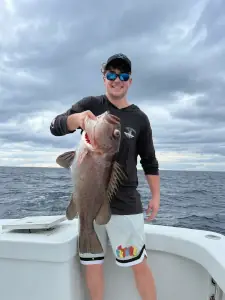 Angler holding a grouper caught offshore in Costa Rica