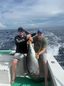 Two generations of anglers with a tuna offshore in Costa Rica